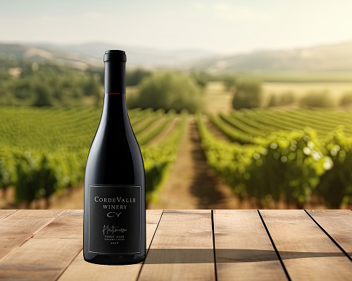 CordeValle Winery red wine bottle overlooking the vineyard